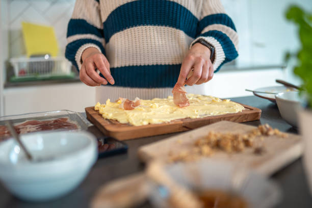 istock Mixed Race Woman Preparing Delicious Butter Board 2200507013