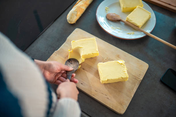 istock Mixed Race Woman Preparing Butter Board in Kitchen 2200507036