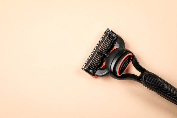 istock Close-up of a shaving razor on a light background, with free space for text 2200507038