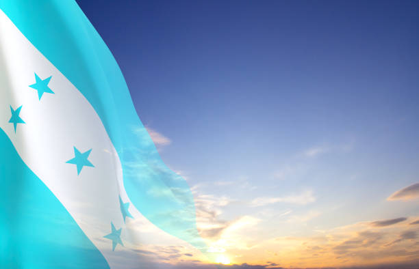 Against the flag of Honduras two passports. The concept of travel and tourism.