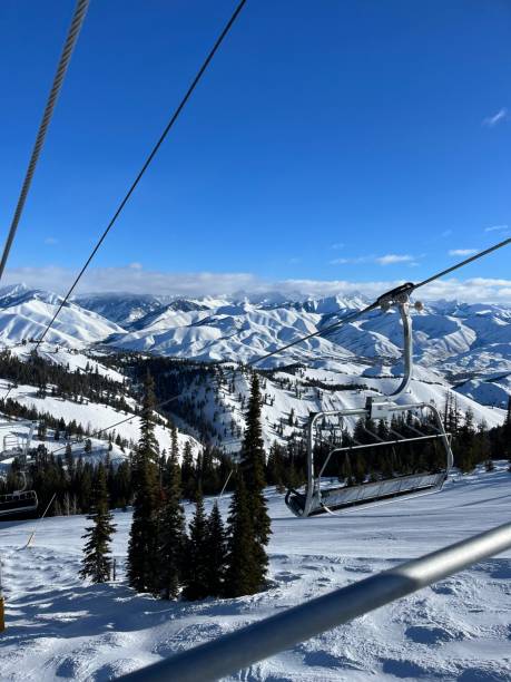 istock Ski Lift Over Expansive Snow-Capped Mountain Range 2200507924