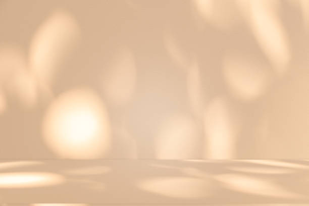 istock Studio style background wall decoration presentation uses white and beige tones. with shadows cast from a nearby window, concept creating a decorative 2200510093