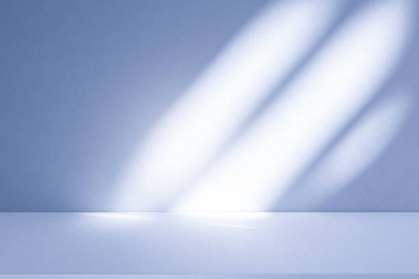 istock Studio style background wall decoration presentation uses white and blue tones. with shadows cast from a nearby window, concept creating a decorative 2200510129