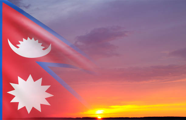 Flag of Nepal against the sunset. National Holidays background