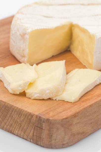 istock Close-up of brie cheese on a wooden board 2200513949