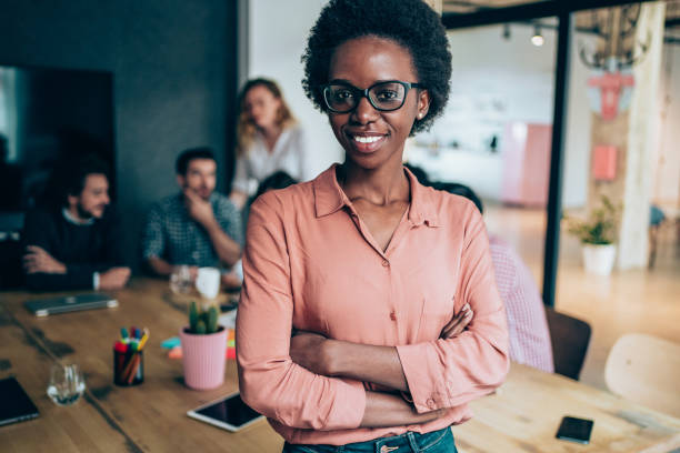 istock Confident businesswoman and her team. 2200517429