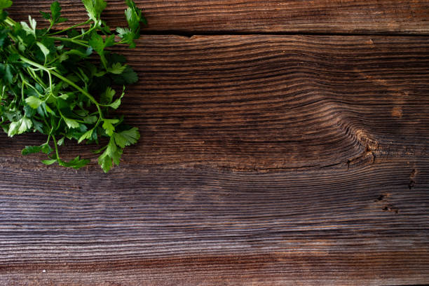 istock Empty wooden table with parsley on side. Top view 2200517555