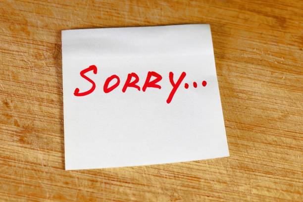 istock sorry inscription on a piece of paper, concept 2200519099