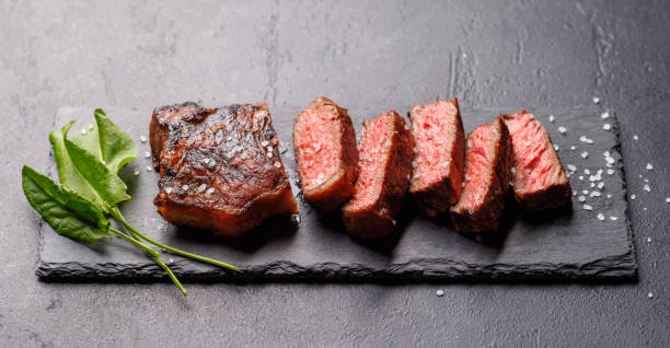 istock A perfectly cooked sliced striploin steak with a juicy, tender texture 2200520189