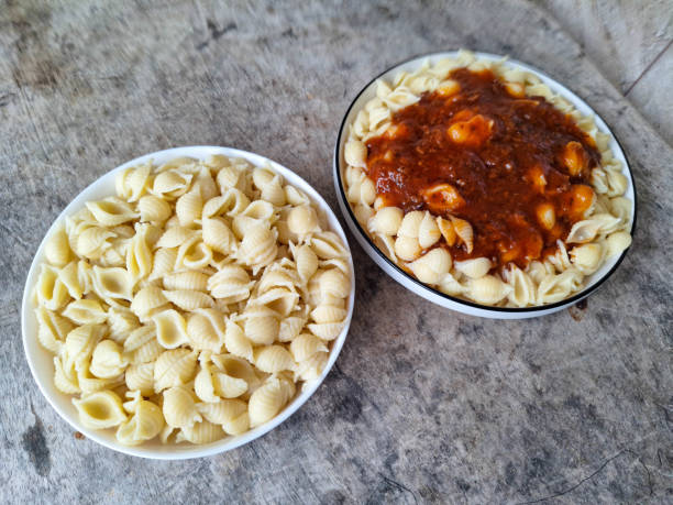 Delicious Shell Conchiglie Macaroni Without Sauce And Shell Conchiglie Macaroni Bolognese. Food Menu.