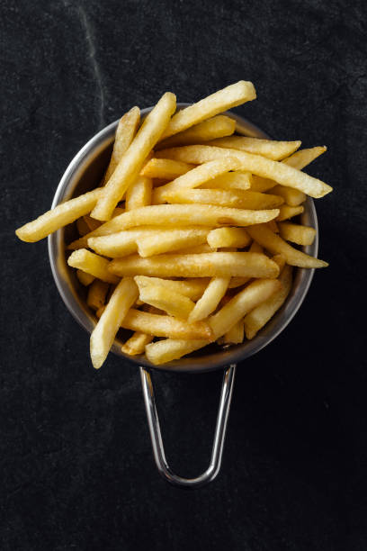 istock French fries on black background 2200522788