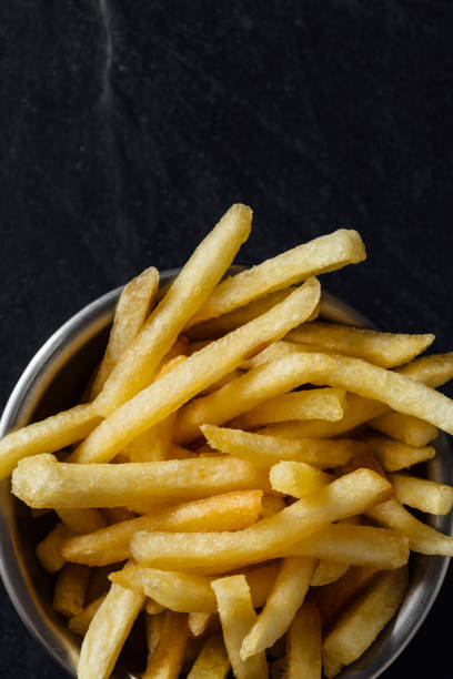 istock French fries on black background 2200522830