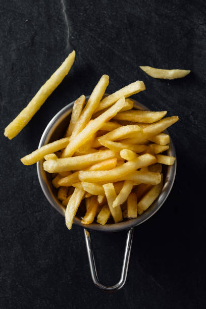 istock French fries on black background 2200522831