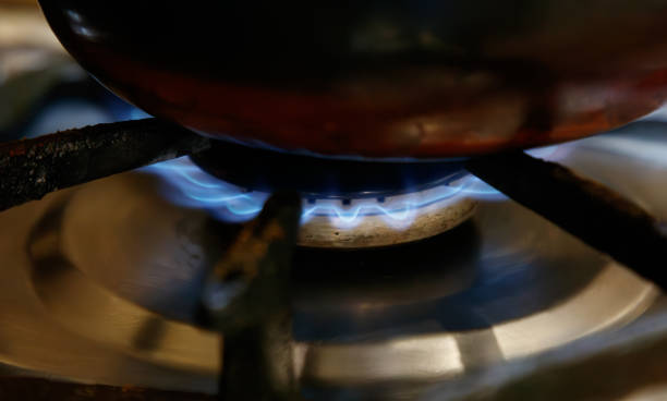 istock A pot is on a stove with a blue flame 2200525393