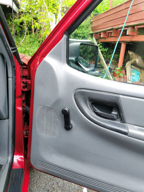 istock Open Red Truck Door Showing Interior Panel and Window in Outdoor Setting 2200526169