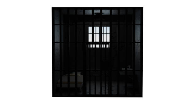 istock 3D model of a solitary prison cell behind bars with a bed and a table and a window with light 2200530012