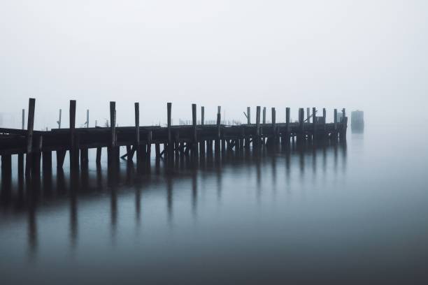 istock Serene, foggy pier extending into calm waters, creating a tranquil and mysterious atmosphere. 2200536976