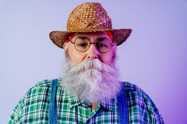 istock Senior old man with gray beard portrait in studio 2200537518