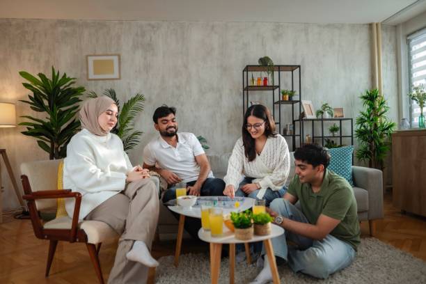 istock Four Young Adults Playing Board Games at Home 2200539134