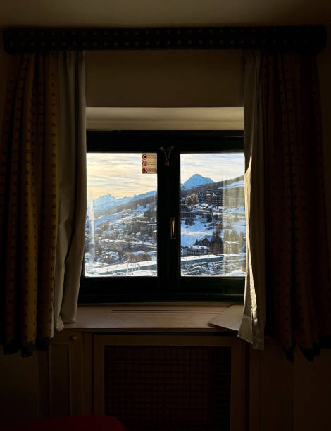 istock Window In A Hotel With A View Of A Snowy Mountain Range 2200541393