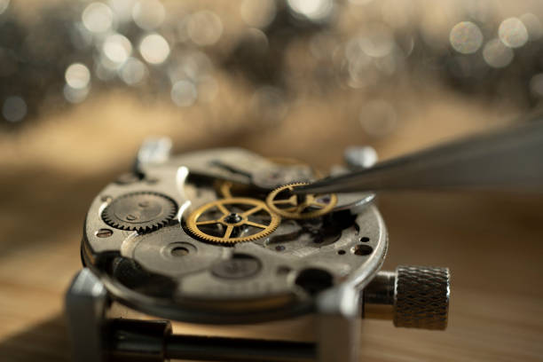 istock watchmaker repairing classic mechanical watch movement 2200542500