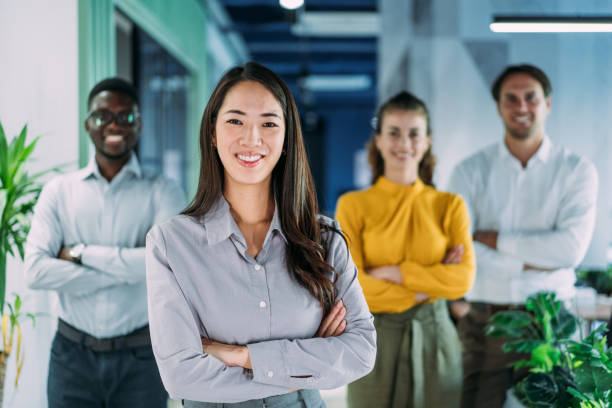 istock Confident businesswoman and her team. 2200542726