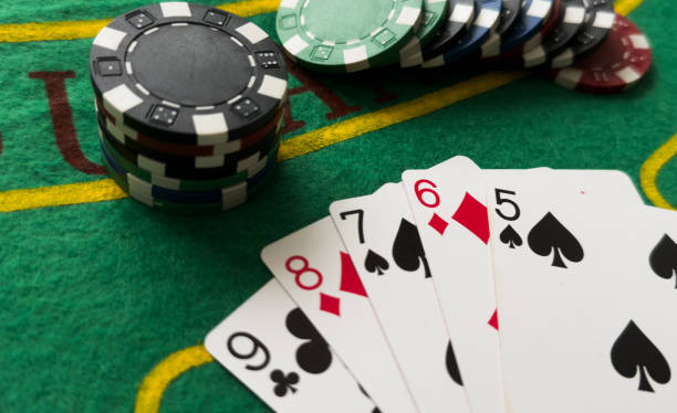 istock playing chips and playing cards close-up. the view from the top 2200543817