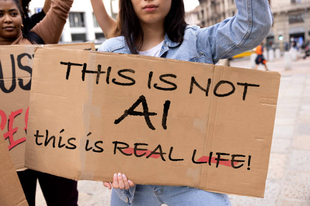istock A person is marching holding a sign against AI 2200545655