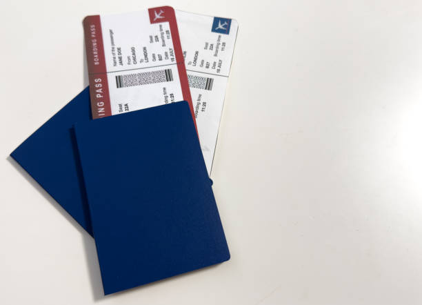 istock international passport, airplane ticket before grey isolated background 2200546330