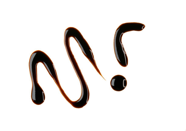 istock Line and drop of brown sauce, syrup isolated on white, clipping path 2200546429