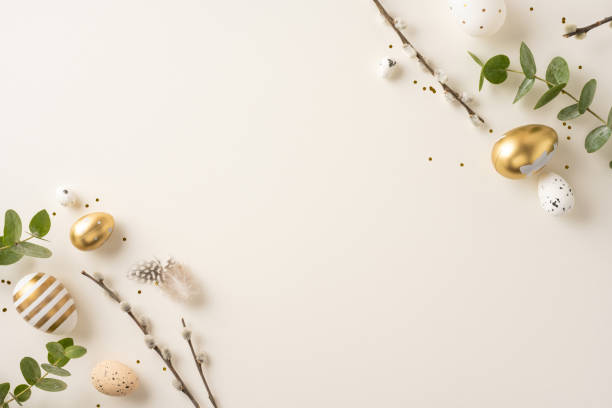 istock Arrangement of golden and speckled Easter eggs with greenery and branches for celebration 2200546837