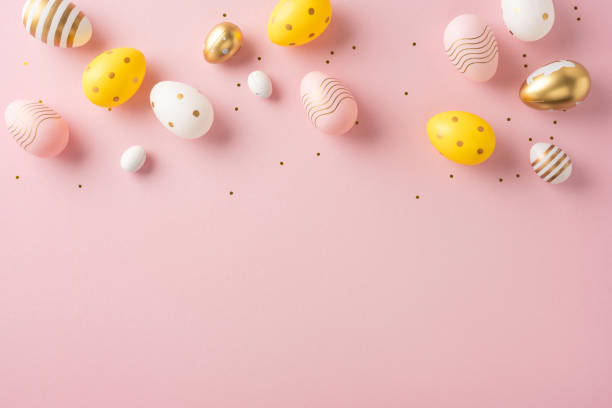 istock Easter eggs arranged on pastel pink background, showing colorful decorations and patterns for festive ambiance 2200546843