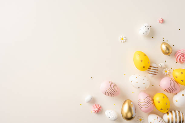 istock Easter eggs in gold and pastel hues arranged artistically on a beige background, creating a festive holiday design 2200546852