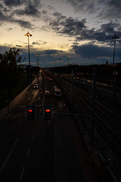 istock Road with traffic. Cars and train at night 2200548344