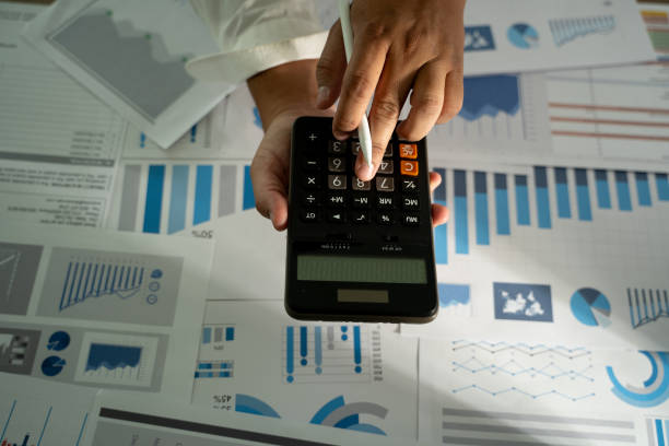 istock man hand using calculator finance budgeting and tax Financial cost calculation statistical data analysis 2200548481