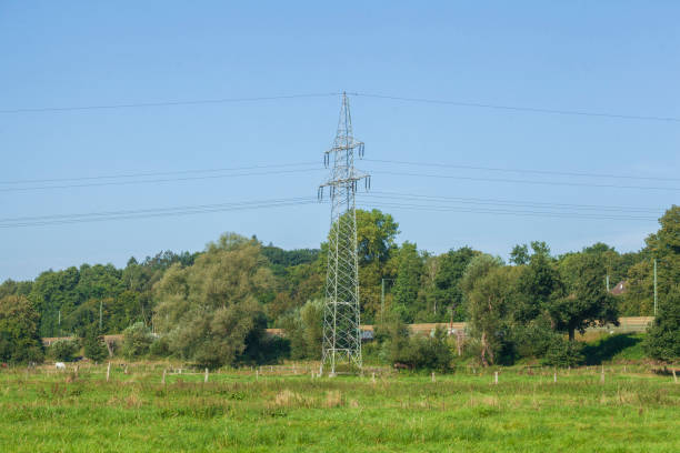 istock electricity pylon, power supply, energy supply, blue sky, Germany 2200550650