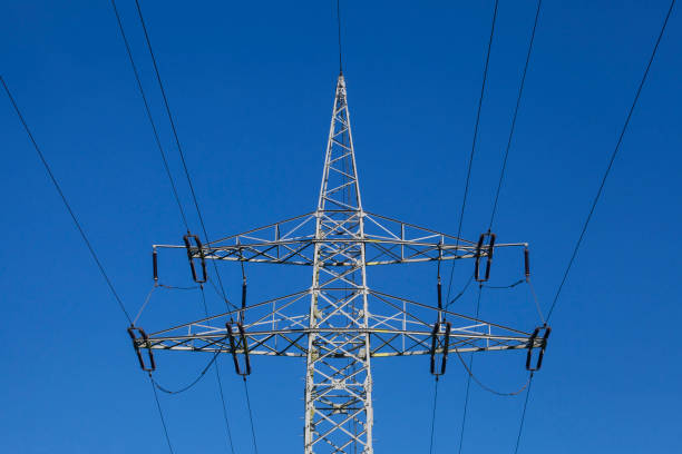 istock electricity pylon, power supply, energy supply, blue sky, Germany 2200550801
