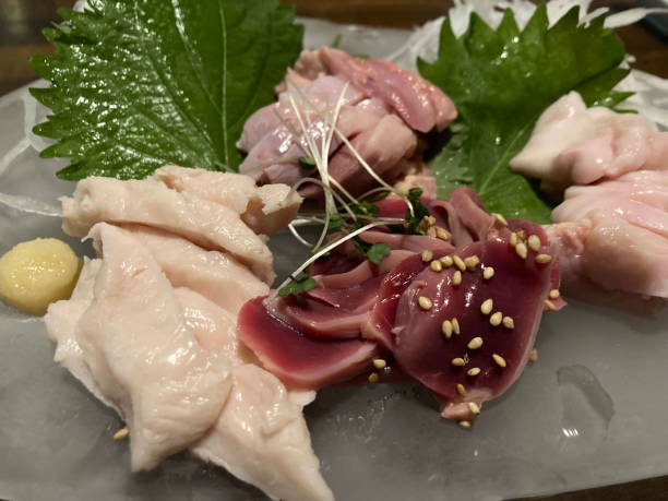 istock Torisashimi with white sesame seeds on the front and sesame leaves on the back. 2200550925