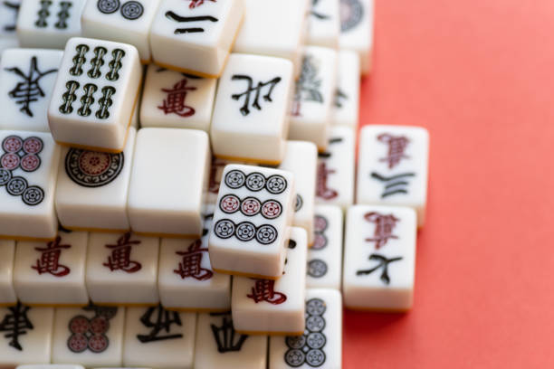 istock Mahjong tiles stacked on a red background 2200553149