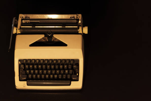 istock Vintage Beige Typewriter on Dark Background for Writers and Creatives 2200553522