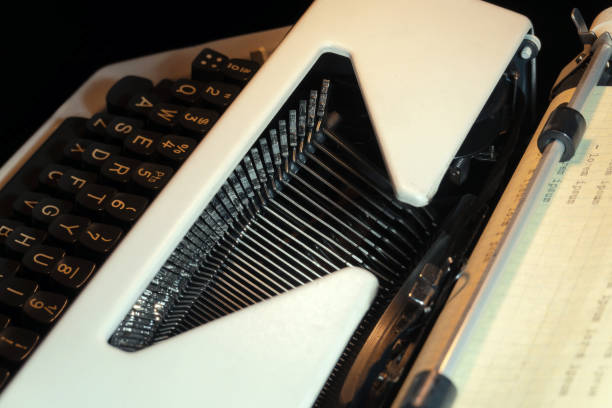 istock Close-Up of Vintage Typewriter Keys with Paper Roll for Writing and Reflection 2200553533