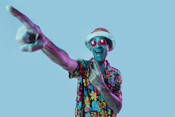 istock Senior man posing in studio under colored gel lights. 2200553614