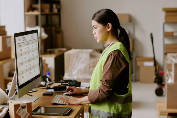 istock Businesswoman Working in Office Looking at Computer 2200553955