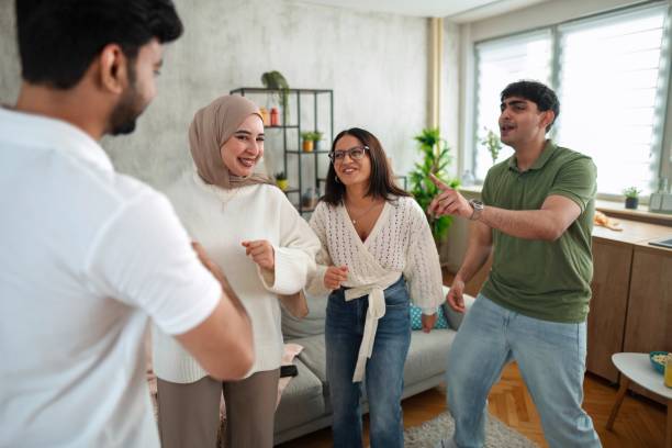 istock Diverse Group of Friends Enjoying Indoor Gathering 2200556000