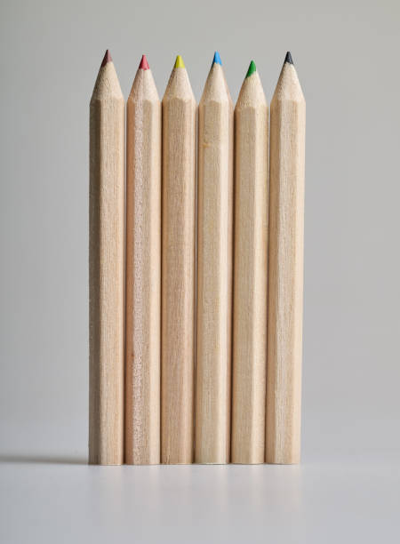 istock Six raw wooden colored pencils on white background 2200556029