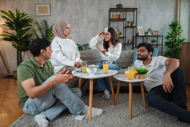 istock Friends playing who am I game and having fun at home 2200556337