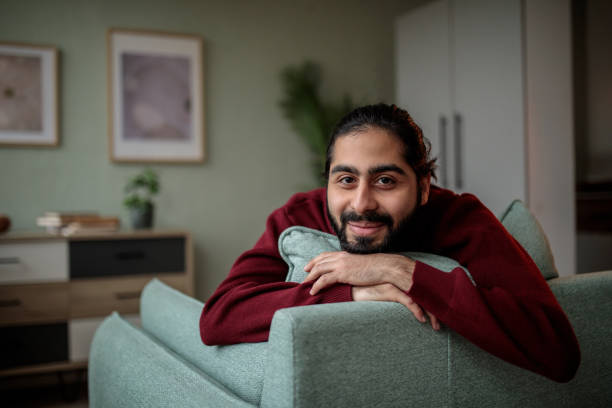 istock Man Relaxing at Home in Comfortable Armchair 2200562400