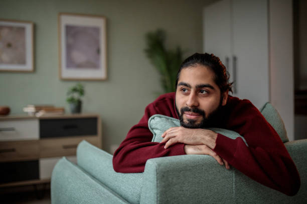 istock Man Relaxing at Home in Comfortable Armchair 2200563083