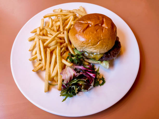 istock Cheese burger and fries serving at glasgow scotland england 2200565253