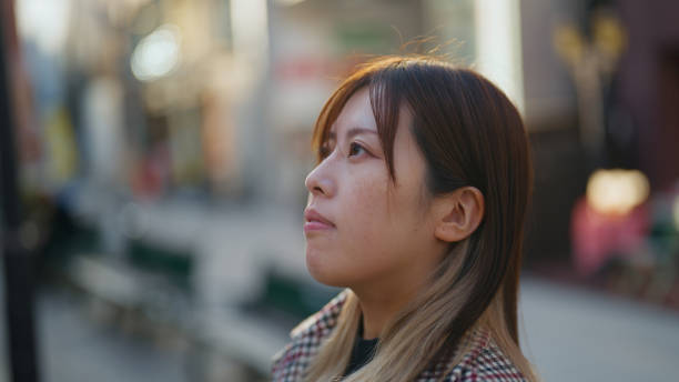 istock Profile Portrait of a Thoughtful Woman 2200565281